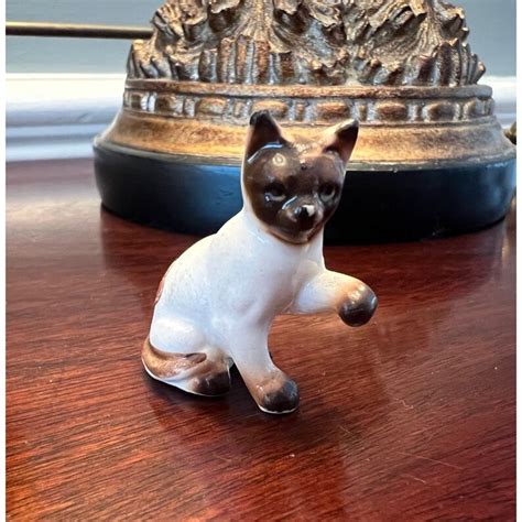 what are bone china cat figureines worth